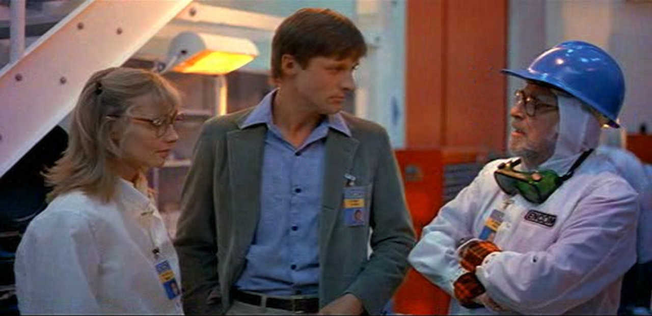 Still from TRON, left to right Linda, Alan, and Gibbs, in conversation.